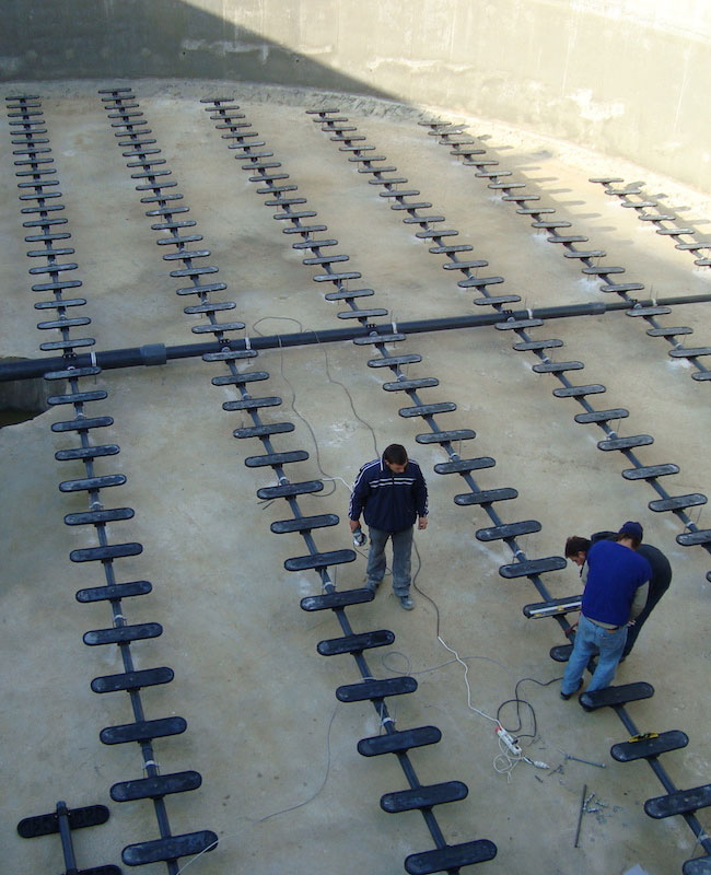 Plate diffuser aeration system installation at industrial WWT plant