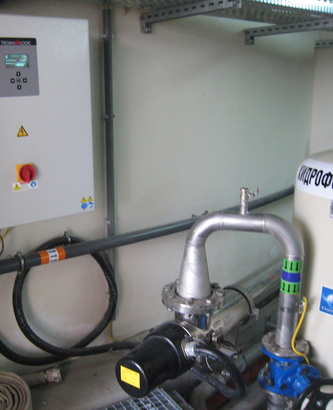 Closed reactor UV disinfection system for process water at a municipal WWTP